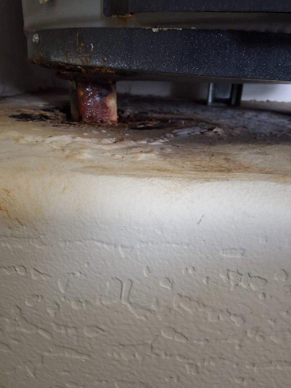 Responded to service call for leaking 40-gallon tall gas water heater (model BFG6240T) located in garage. Upon inspection, confirmed active leak and severe rust corrosion on tank base and mounting components, indicating tank failure. Performed complete removal of failed unit and installed new 40-gallon gas water heater. Connected copper supply lines, flexible gas connector with yellow-jacketed gas line, and verified proper venting. Tested all connections for leaks, confirmed gas valve operation, and ensured unit achieved proper ignition and heating cycle. New American-brand water heater installed and fully operational with all safety labels and specifications visible.