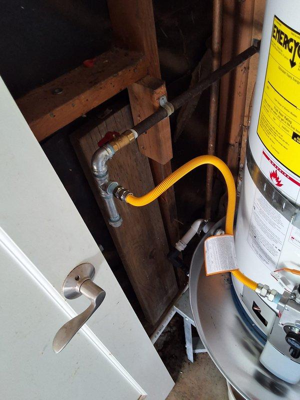 Responded to service call for leaking water heater. Upon inspection, found approximately 15-year-old State Industries gas water heater (Model GS650Y0CTG200) with active leak. Evaluated unit condition, including gas line connections, venting system, plumbing connections, and overall installation configuration. Documented equipment with photographs showing water heater installation, flexible gas connector, copper supply lines, galvanized piping with shutoff valve, and drain pan at base. Discussed replacement options with property owner, including new water heater model recommendations, permit requirements for installation, and available payment methods. Provided rough estimate range for complete water heater replacement. Scheduled follow-up appointment window for potential installation work.