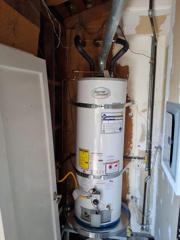 Responded to service call for leaking water heater. Upon inspection, found approximately 15-year-old State Industries gas water heater (Model GS650Y0CTG200) with active leak. Evaluated unit condition, including gas line connections, venting system, plumbing connections, and overall installation configuration. Documented equipment with photographs showing water heater installation, flexible gas connector, copper supply lines, galvanized piping with shutoff valve, and drain pan at base. Discussed replacement options with property owner, including new water heater model recommendations, permit requirements for installation, and available payment methods. Provided rough estimate range for complete water heater replacement. Scheduled follow-up appointment window for potential installation work.