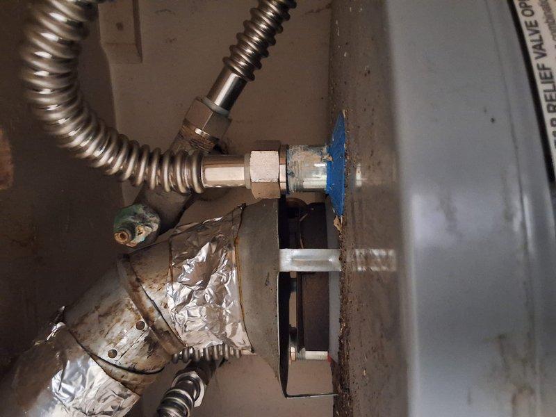 Responded to property management no hot water call. Upon arrival, performed diagnostic evaluation of water heater system using digital multimeter to test electrical components and voltage supply. Inspected gas line connections, flexible conduit, and compression fittings at wall penetration point. Documented equipment condition and findings with photos for office review and pricing determination. Evaluation completed and reported to dispatch per property management protocol.