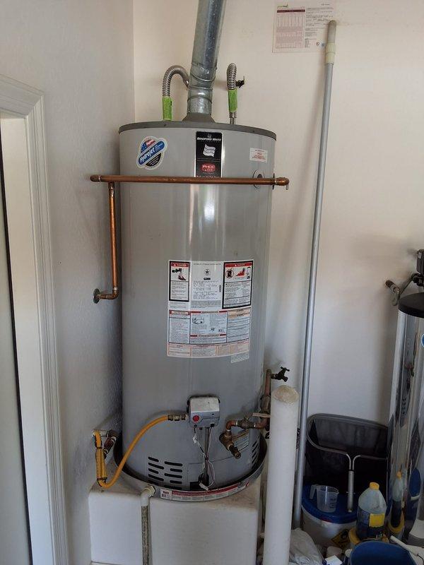 Performed inspection on 7-year-old Bradford White 75-gallon natural gas water heater (Model RG275H6N) due to customer concerns about rusty water. Evaluated unit condition, anode rod deterioration, and overall system performance. Documented equipment specifications and current installation configuration. Provided customer with assessment findings and presented options for anode rod replacement versus full water heater replacement based on age and condition of existing unit.
