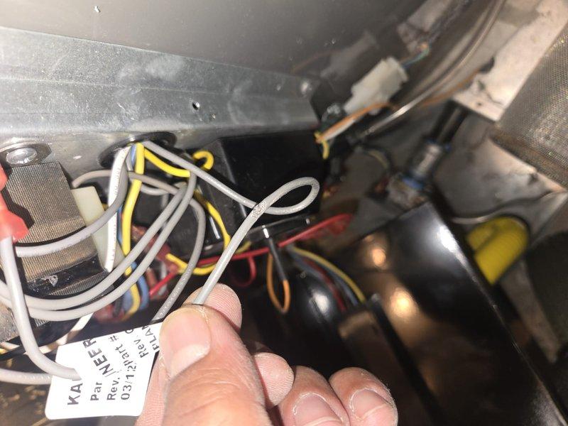 Responded to no hot water complaint at hotel facility. Diagnosed Rheem GNU100-200 water heater located in 3rd floor mechanical room. Performed electrical inspection of control board, wiring connections, and capacitor components. Documented existing wire connections and electrical components for repair assessment.
