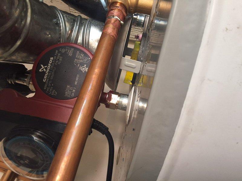 Completed warranty follow-up service on American Standard water heater installation by installing Grundfos comfort pump with proper copper piping connections and flow meter integration. Verified installation of second anode rod and applied appropriate manufacturer specification labels and stickers to unit as required for warranty compliance.