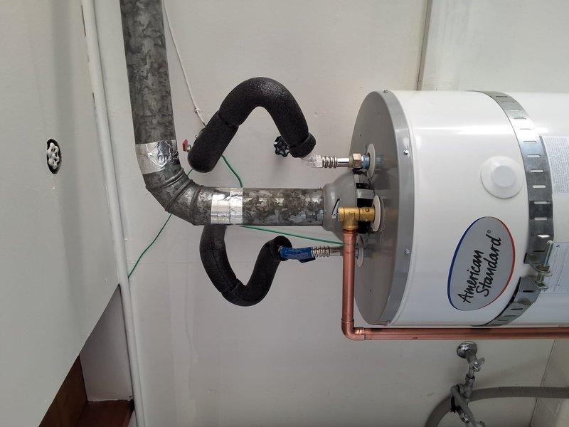 Successfully replaced a 30-gallon gas water heater located in the garage with a new American Standard unit. Removed the existing water heater and installed the replacement, connecting all necessary gas supply lines, water supply and discharge piping, temperature and pressure relief valve, and proper venting through the existing black vent pipe system to the ceiling exhaust. All connections were secured with appropriate fittings, clamps, and shut-off valves to ensure safe and code-compliant operation.