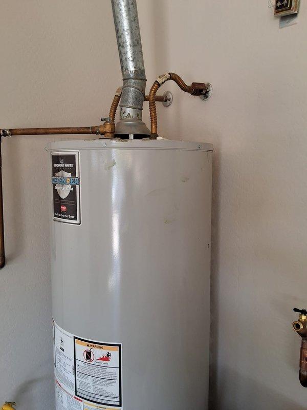 Performed preventive maintenance inspection on a 50-gallon Bradford White natural gas water heater, model RG250T6N. Verified proper operation of all components, inspected venting system, water connections, and safety controls. Documented equipment condition with photos and discussed replacement options for future planning.