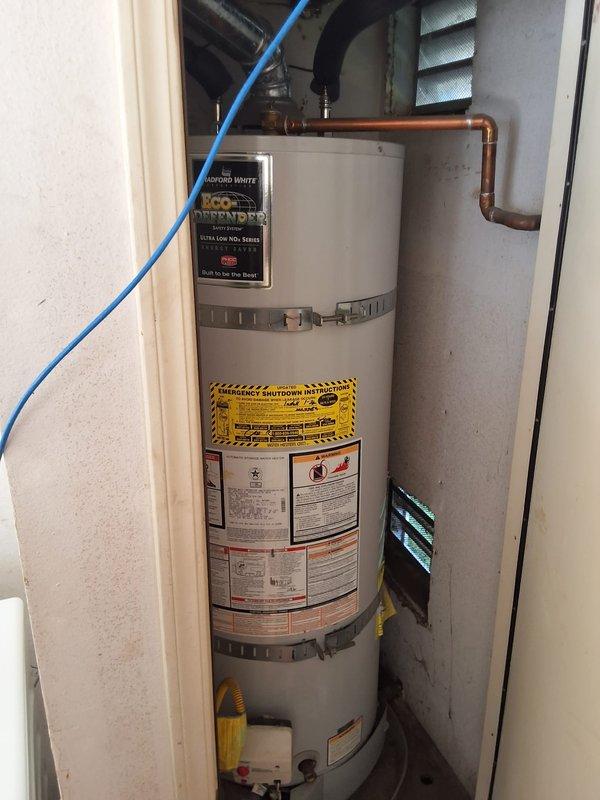 Conducted inspection and provided estimate for proactive replacement of existing residential gas water heater with new 40-gallon Bradford White gas water heater unit. Evaluated current installation in utility closet including copper supply piping, venting configuration, and clearance requirements. Discussed permit requirements for water heater replacement and provided ballpark estimate range for complete installation including new unit, necessary code-compliant connections, and proper venting. Customer expressed interest in proceeding with replacement ahead of anticipated regulatory changes. Documented existing installation with photographs showing current water heater condition, labeling, and mechanical room configuration.