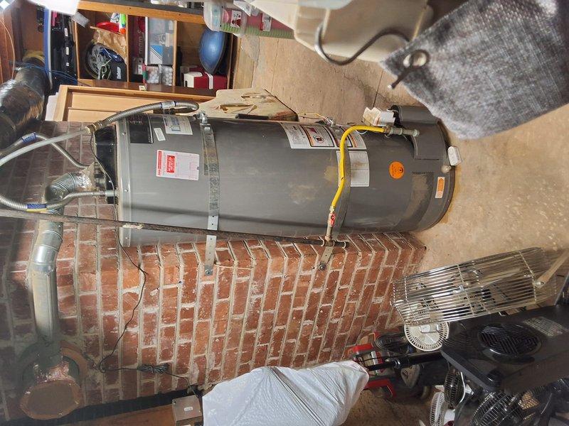 Completed inspection and provided estimate for replacement of existing 50-gallon gas water heater (Bradford White and American Standard options discussed) installed in 2019. Evaluated current unit condition and surrounding installation area in basement utility space. Discussed permit requirements for replacement work and presented pricing for 50-gallon gas water heater installation with available payment options.