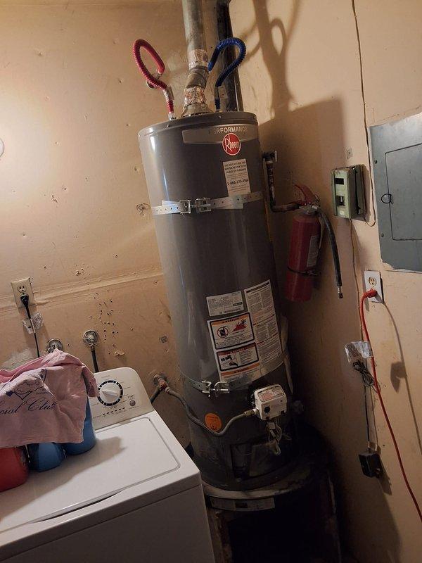 Performed inspection and estimate for water heater replacement. Documented existing Rheem gas water heater model XG40T06EN38U1, serial number M362219782, located in utility room alongside washing machine. Photographed unit specifications, safety labels, installation configuration including water supply connections and venting. Provided customer with replacement options and preliminary cost estimate for new water heater installation. Scheduled follow-up appointment for Thursday 10AM-1PM to discuss permit requirements and finalize installation details.