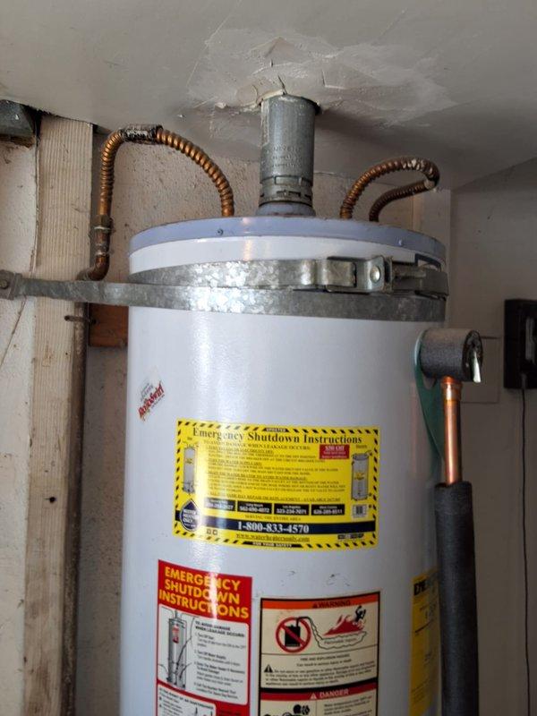 Completed preventative replacement of existing AO Smith 50-gallon gas water heater with new American Standard 50-gallon gas unit. Installed unit on wooden platform with proper seismic strapping, connected flexible gas line and copper water supply lines with expansion loops, and ensured all connections meet code requirements. City permit obtained for installation per local regulations.