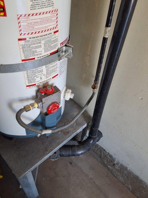 Replaced existing 40-gallon gas water heater in garage with new Richmond 40-gallon gas unit featuring self-cleaning technology and 9-year limited warranty on tank and parts. Installed unit on elevated metal stand per code requirements, connected flexible gas line to gas control valve assembly, and completed all water pipe connections. Verified proper operation of all safety controls and ensured compliance with applicable building codes and permitting requirements.