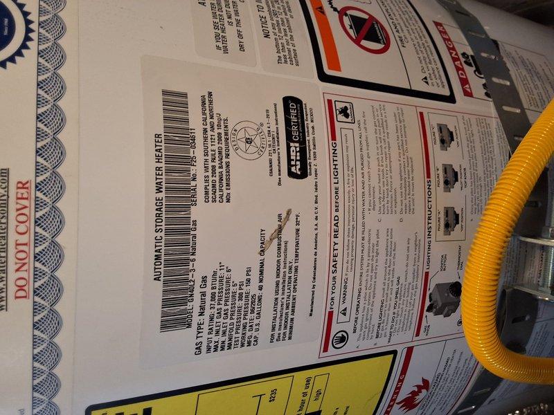 Performed inspection and consultation for 40-gallon American Standard gas water heater currently located in garage being converted to living space. Evaluated existing installation including gas line connections, venting system, and mounting configuration to determine compliant relocation or replacement options. Discussed multiple solutions with homeowner including tankless water heater conversion, electric water heater replacement, exterior shed installation for existing tank relocation, and code requirements for each option to ensure proper clearances and safety compliance for the converted living space.