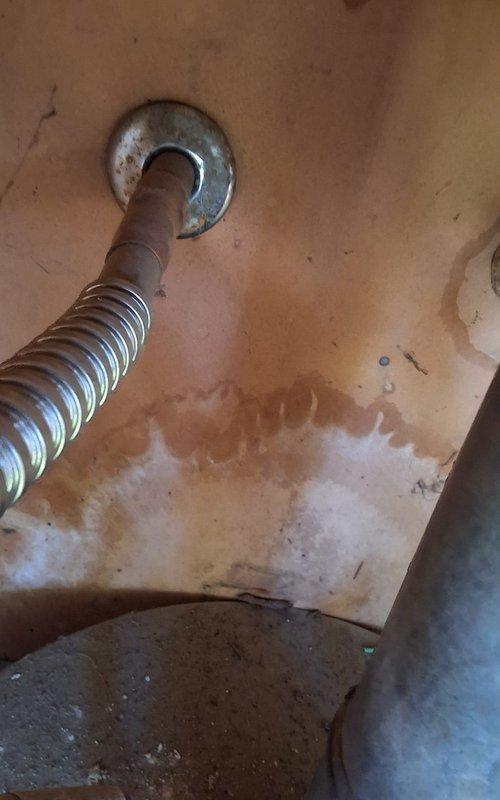 Completed full residential gas water heater replacement per approved estimate. Removed existing 40-gallon gas water heater (Model U440T6FRN, Serial KH18713983) from outdoor closet location and installed new 40-gallon gas water heater (Model GN40T1-3-6) with drain pan. Connected gas supply lines using flexible metallic connectors with shutoff valves on both sides, installed new galvanized metal flue vent pipe with proper vertical routing through enclosure ceiling, and verified all connections for proper operation and safety. Customer approved permit requirements prior to installation. All work completed to code specifications with system tested and operational upon departure.