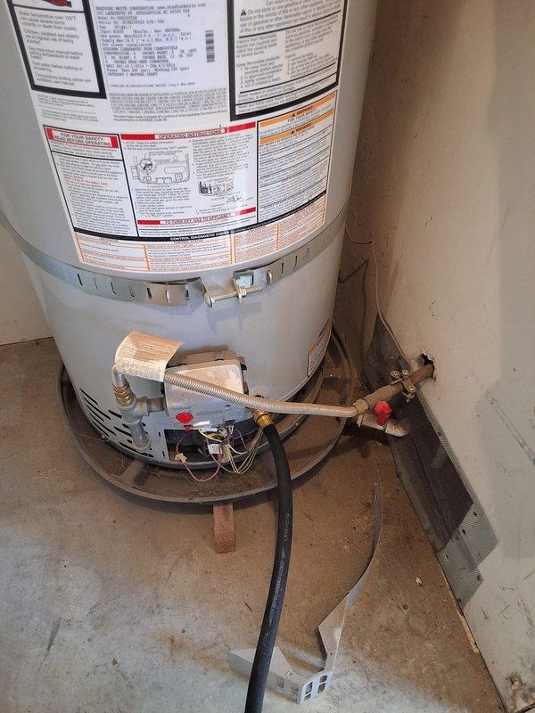 Responded to property management service call for 50-gallon gas water heater (Model: URG250T6N, Serial: PC39236526) with pilot light failure. Upon arrival, accessed unit located in exterior utility closet on patio and performed diagnostic evaluation of gas control valve, thermocouple, and pilot assembly. Documented existing conditions with photographs showing water heater installation, plumbing connections, gas line configuration, and overall unit condition. Contacted office with findings per property management protocol for pricing approval prior to completing any repairs.