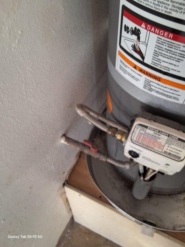Responded to a leaking 11-year-old 29-gallon gas water heater (model XG29T09FG3) and successfully replaced it with a new 40-gallon gas water heater unit. Removed the failed tank, installed the replacement unit with proper venting and gas connections, and positioned it on a drain pan in the utility room. All safety labels, warning placards, and plumbing connections were properly installed and tested for proper operation.