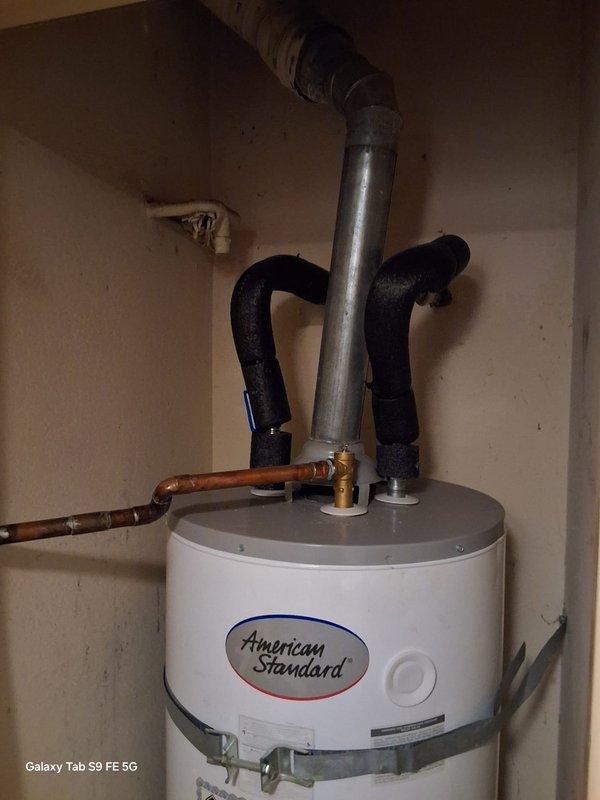 Responded to no pilot light condition on American Standard natural gas water heater model GN50T1-3-6NAT. Upon arrival, inspected gas control valve, thermocouple, and pilot assembly. Verified gas supply through yellow flexible connector and confirmed proper venting. Successfully relit pilot light and tested main burner operation to ensure proper ignition sequence and flame characteristics. Unit restored to full operational status under manufacturer warranty coverage.