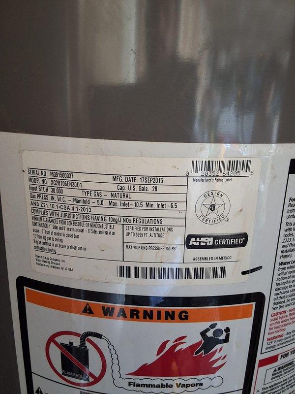 Inspected 10-year-old Rheem 28-gallon gas water heater (Model XG28T06, Serial M391500037, manufactured September 2015) per customer request for replacement evaluation. Provided estimate for replacement with either 40-gallon or 50-gallon gas water heater unit, discussed permit requirements, and documented existing installation with photographs showing current equipment condition and utility closet configuration.