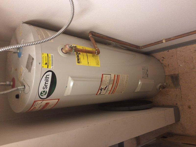 Completed preventative maintenance inspection and estimate for replacement of existing 2011 A.O. Smith 50-gallon tall electric water heater serving kitchen and restroom facilities at a church. Inspected current unit, documented installation conditions including copper supply piping, pressure relief valve, flexible connectors, and platform mounting, and photographed existing setup to provide replacement estimate for aging equipment.