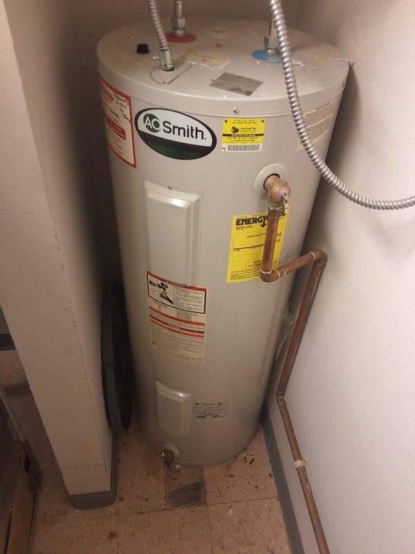 Completed preventative maintenance inspection and estimate for replacement of existing 2011 A.O. Smith 50-gallon tall electric water heater serving kitchen and restroom facilities at a church. Inspected current unit, documented installation conditions including copper supply piping, pressure relief valve, flexible connectors, and platform mounting, and photographed existing setup to provide replacement estimate for aging equipment.