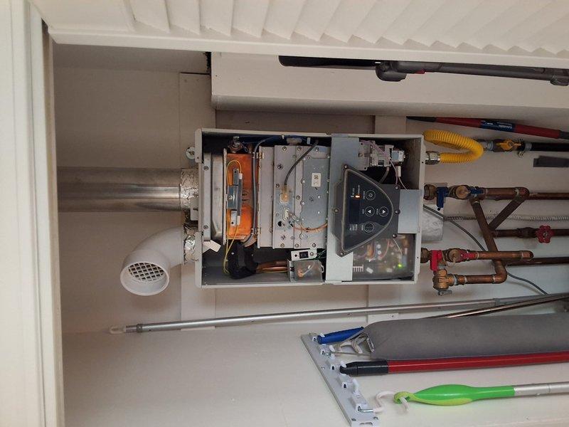 Responded to service call for Takagi tankless water heater experiencing ignition issues. Performed diagnostic inspection of unit with front cover removed to access internal components including heat exchanger, burner assembly, control panel, and electrical connections. Evaluated condition of copper piping, gas supply line, shut-off valves, and venting system. Discussed replacement options with Navien tankless water heater as alternative solution. Provided estimate for repair service and full system replacement with permit requirements. Documented equipment condition through photographs and presented available payment methods for approved work.