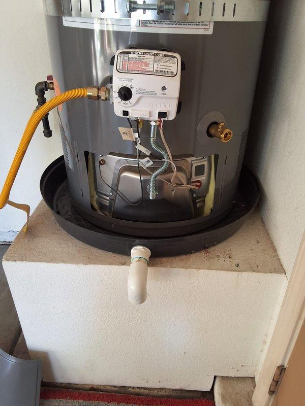 Responded to service call for installation of customer-supplied burner control assembly on residential water heater. Unit identified as Rheem PROG50-38URH6ECI-1, serial number M062105429. Successfully removed existing gas valve control assembly and installed replacement burner control unit provided by customer. Verified all gas connections were secure and tested for leaks using approved methods. Confirmed proper operation of new control assembly including pilot ignition, main burner operation, and temperature regulation functionality. Cycled unit through multiple heating cycles to ensure reliable performance. Inspected all associated components including yellow flexible gas supply line, water connections with gray flexible connectors, brass fittings, and PVC discharge piping. Verified proper venting and clearances around unit installed in utility closet on elevated white platform with black drip pan. All safety controls tested and functioning within manufacturer specifications. Unit re