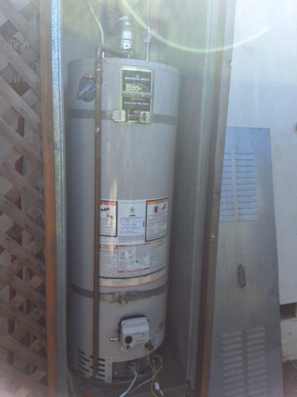 Responded to service call for pilot light that would not stay lit on a 2019 Bradford White residential gas water heater, Model URG240T6N. Upon arrival, performed diagnostic inspection of the gas control valve, thermocouple, and pilot assembly. Evaluated combustion chamber for proper ventilation and checked gas supply line connections. Inspected burner assembly and flame sensor components to identify cause of pilot failure. Documented unit specifications and current condition with photographs for service records.