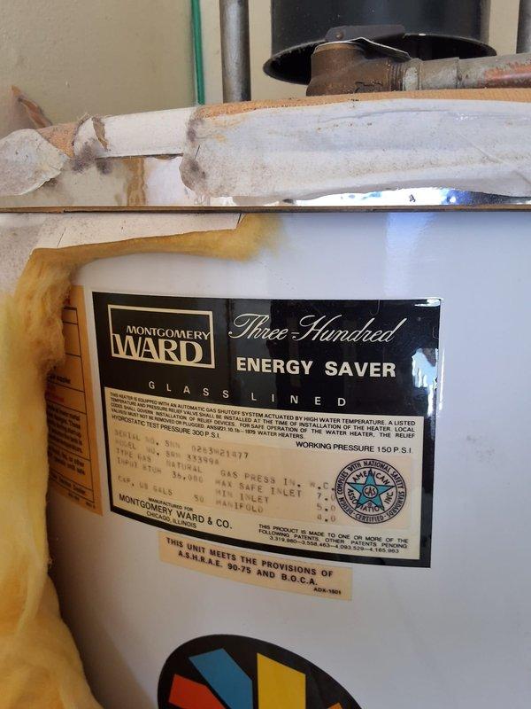 Removed and replaced aging Montgomery Ward "Three Hundred" gas water heater showing significant rust staining and exterior deterioration. Installed new gas water heater with proper connections to existing gas line and plumbing, ensuring all safety codes and manufacturer specifications were met. Discussed permit requirements and payment options with property owner upon completion of installation.