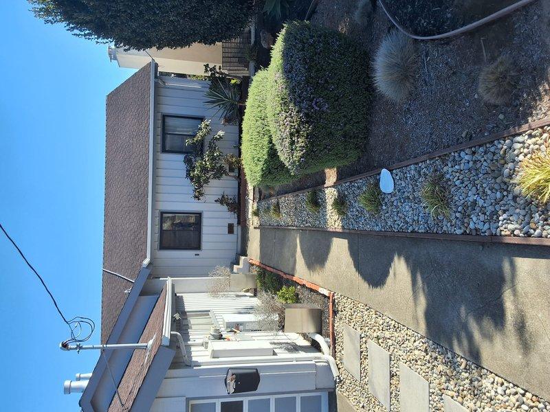 Completed preventative maintenance inspection and heat pump replacement estimate for residential property with existing 80G gas heating system. Coordinated access through family contact and scheduled appointment window. Discussed permitting requirements for future heat pump installation and provided ballpark pricing for replacement options. Documented property exterior and interior access points with photographs for equipment replacement planning.