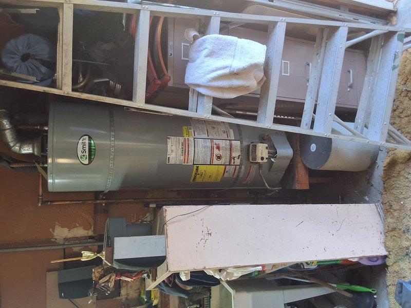 Completed inspection for preventative replacement of existing AO Smith 40-gallon gas water heater (Model GNR40200, Serial 1409T458289). Provided estimate for replacement with American Standard 40-gallon gas unit, including permit requirements for Redwood City jurisdiction. Scheduled installation appointment and documented existing HVAC system configuration with photographs showing furnace unit, ductwork connections, and mechanical room layout.