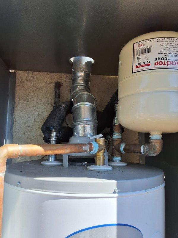 Completed warranty service on GN40T1-3-6NAT water heater experiencing recurring pilot light issues within first year of installation. Multiple service calls addressed pilot assembly failure, requiring removal of insulation for cleaning and eventual replacement of pilot assembly, followed by gas control valve replacement after continued intermittent operation. Upon final visit, replaced gas control valve assembly, restored proper pilot operation, and verified water temperature delivery at 120°F at fixtures, resolving all ignition and temperature control issues.