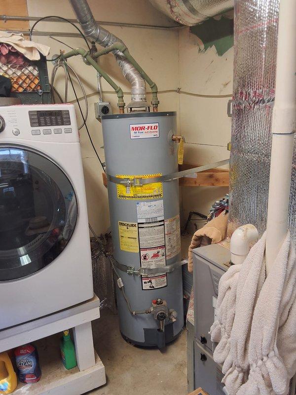 Performed inspection and estimate for replacement of existing 10+ year old 50-gallon gas water heater. Customer requested quote for upgrading to a 50-gallon Navien heat pump water heater to comply with upcoming electrical mandate requirements. Discussed permit requirements for installation and scheduled follow-up appointment for Wednesday between 11 AM and 2 PM to review detailed proposal and proceed with replacement.