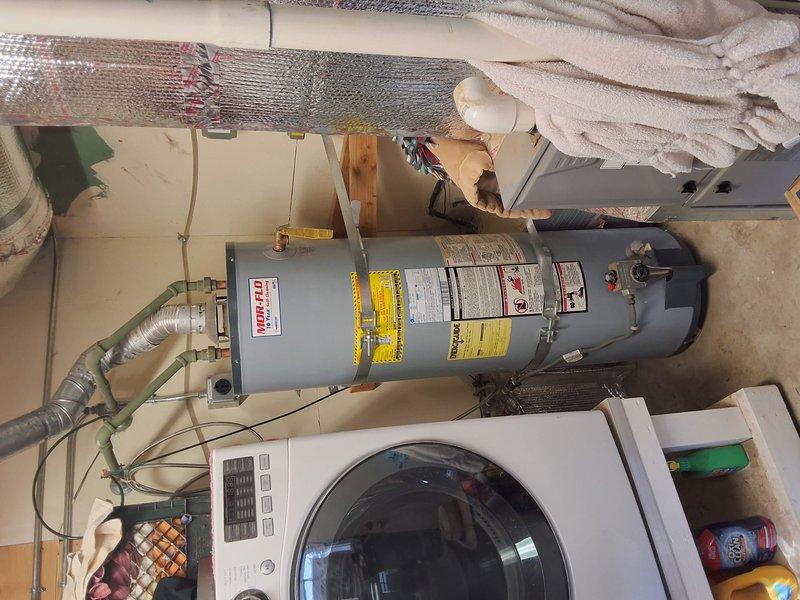 Performed inspection and estimate for replacement of existing 10+ year old 50-gallon gas water heater. Customer requested quote for upgrading to a 50-gallon Navien heat pump water heater to comply with upcoming electrical mandate requirements. Discussed permit requirements for installation and scheduled follow-up appointment for Wednesday between 11 AM and 2 PM to review detailed proposal and proceed with replacement.