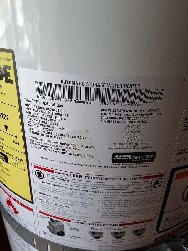 Responded to warranty service call for 40-gallon natural gas automatic storage water heater, Model GN40T1-3-6, Serial B25-007708. Performed diagnostic inspection of unit to identify reported issue and verify warranty coverage eligibility. Inspected water heater tank exterior condition, verified all manufacturer specification labels and safety documentation intact and legible. Evaluated system pressure using gauge measurement to confirm proper operating parameters within acceptable range. Documented equipment condition through photographs showing tank specifications, AHRI certification, and pressure monitoring equipment. Completed warranty inspection and verified unit operational status.