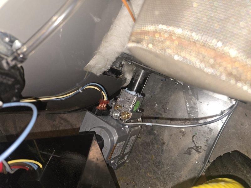 Responded to warranty call for HVAC system diagnostics to restore unit operation. Upon inspection, examined gas valve assembly, electrical connections, and associated components within the furnace cabinet. Verified proper wiring connections including ground wire, checked gas valve operation, and inspected refrigerant line insulation and mounting hardware. Diagnosed system issues preventing unit from coming online and completed necessary adjustments to restore equipment to proper working condition.