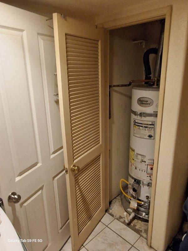 Responded to no hot water complaint on American Standard natural gas water heater model GN50T1-3-6NAT. Performed manufacturer warranty service including thorough cleaning of burner assembly and pilot assembly, and removed insulation material from bottom of unit that was potentially interfering with proper combustion. Unit restored to proper operation with hot water production confirmed upon completion.
