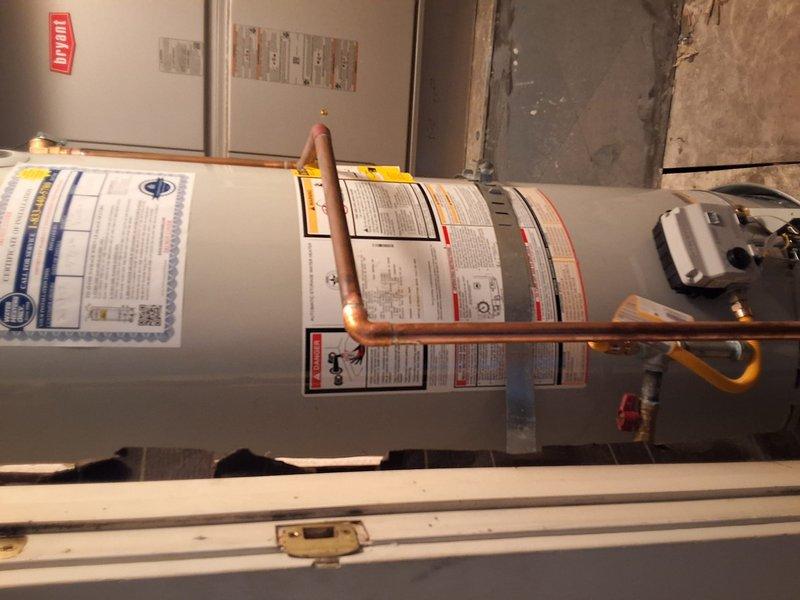Replaced a 12-year-old Rheem 50-gallon natural gas water heater (Model PROG48, Serial M041408417) with a new 50-gallon gas unit. Installed new copper supply piping connections, pressure relief valve, and flexible gas line with shutoff valve. Permit requirements were discussed with property owner, and all installations comply with local plumbing and mechanical codes.