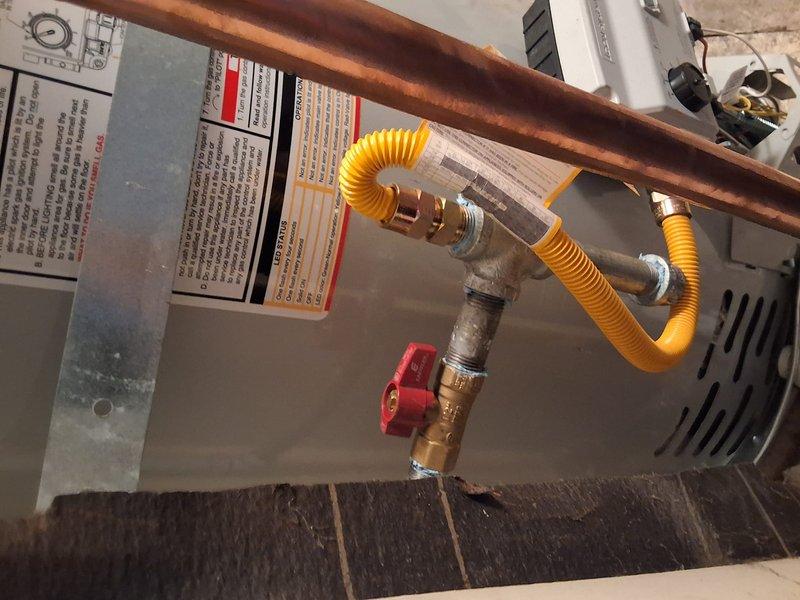 Replaced a 12-year-old Rheem 50-gallon natural gas water heater (Model PROG48, Serial M041408417) with a new 50-gallon gas unit. Installed new copper supply piping connections, pressure relief valve, and flexible gas line with shutoff valve. Permit requirements were discussed with property owner, and all installations comply with local plumbing and mechanical codes.