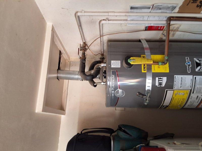 Completed preventative replacement of existing Rheem 50-gallon gas water heater with new American Standard 50-gallon gas unit. Installation included proper connection of water supply lines, gas line with flexible connector, temperature and pressure relief valve, and venting system per manufacturer specifications. All plumbing connections secured with copper piping routed to ceiling, shut-off valves installed for future serviceability, and unit tested for proper operation and leak-free performance.