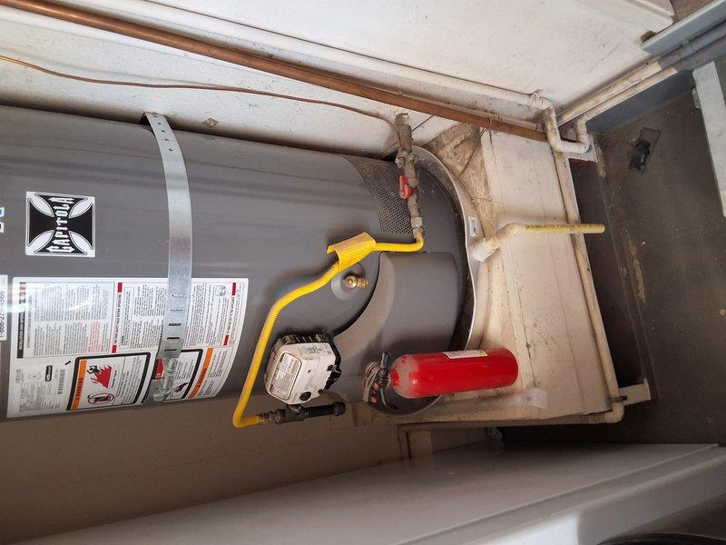 Completed preventative replacement of existing Rheem 50-gallon gas water heater with new American Standard 50-gallon gas unit. Installation included proper connection of water supply lines, gas line with flexible connector, temperature and pressure relief valve, and venting system per manufacturer specifications. All plumbing connections secured with copper piping routed to ceiling, shut-off valves installed for future serviceability, and unit tested for proper operation and leak-free performance.