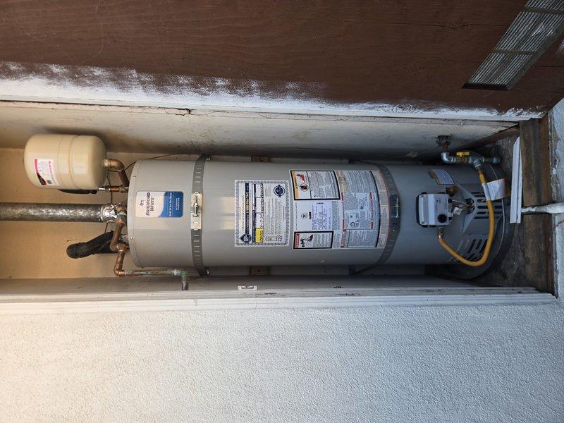 Responded to warranty service call for Bradford White gas water heater model URG140T6N. Upon inspection, found that the flexible gas line installation was improperly positioned, blocking access to the drain valve and preventing routine flushing maintenance. Relocated and reinstalled gas line to proper position, ensuring clearance from drain valve while maintaining code-compliant connections and safe operation. Verified all gas connections for leaks, confirmed proper water heater function, and restored full access to drain valve for future maintenance requirements.