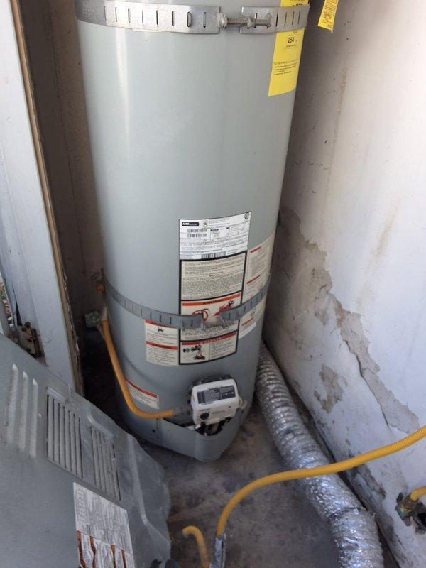 Performed inspection and estimate on a 2014 Kenmore 40-gallon gas water heater, model 153.330220, with previous recall tank replacement history. Evaluated unit condition and discussed repair versus replacement options, advising replacement due to age exceeding 10 years. Provided replacement estimate and discussed permit requirements for new installation.