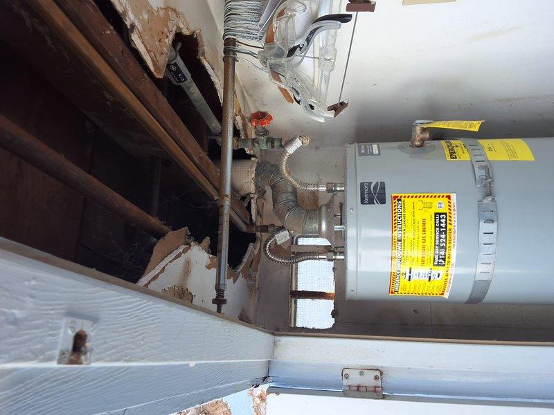 Performed inspection and estimate on a 2014 Kenmore 40-gallon gas water heater, model 153.330220, with previous recall tank replacement history. Evaluated unit condition and discussed repair versus replacement options, advising replacement due to age exceeding 10 years. Provided replacement estimate and discussed permit requirements for new installation.