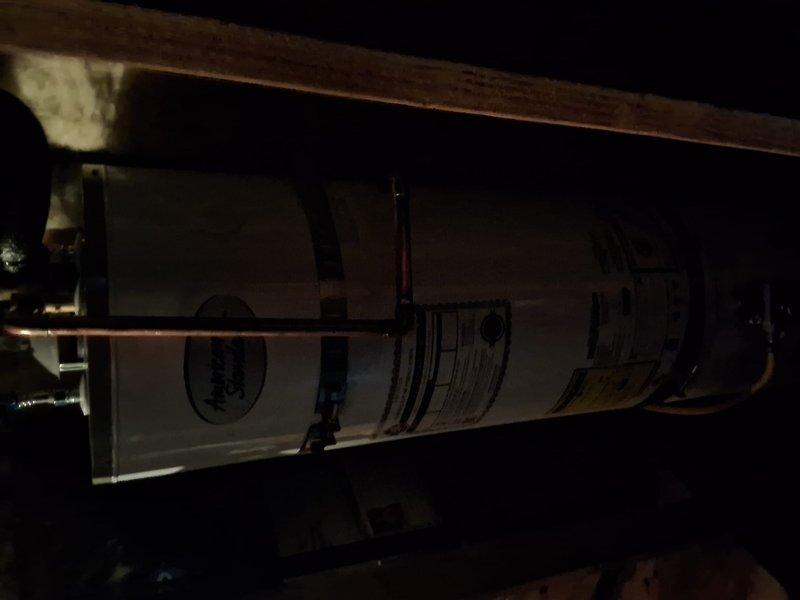 Responded to property management account for reported water heater leak. Upon arrival, conducted thorough inspection of 40-50 gallon gas water heater installation and associated plumbing components. Evaluated HVAC system in attic space and examined condensate drainage system. Inspected pressure relief valve, water supply lines, and connections for signs of active leaking. Documented heavy condensation present on insulated cold water lines and assessed condition of expansion tank and shut-off valves. Photographed findings and contacted office with complete evaluation for pricing approval per property management protocol.