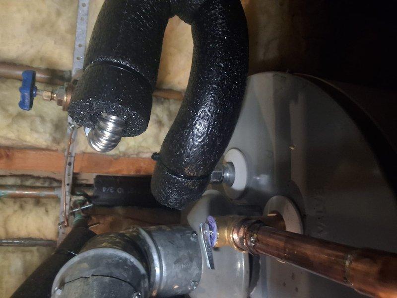 Responded to property management account for reported water heater leak. Upon arrival, conducted thorough inspection of 40-50 gallon gas water heater installation and associated plumbing components. Evaluated HVAC system in attic space and examined condensate drainage system. Inspected pressure relief valve, water supply lines, and connections for signs of active leaking. Documented heavy condensation present on insulated cold water lines and assessed condition of expansion tank and shut-off valves. Photographed findings and contacted office with complete evaluation for pricing approval per property management protocol.