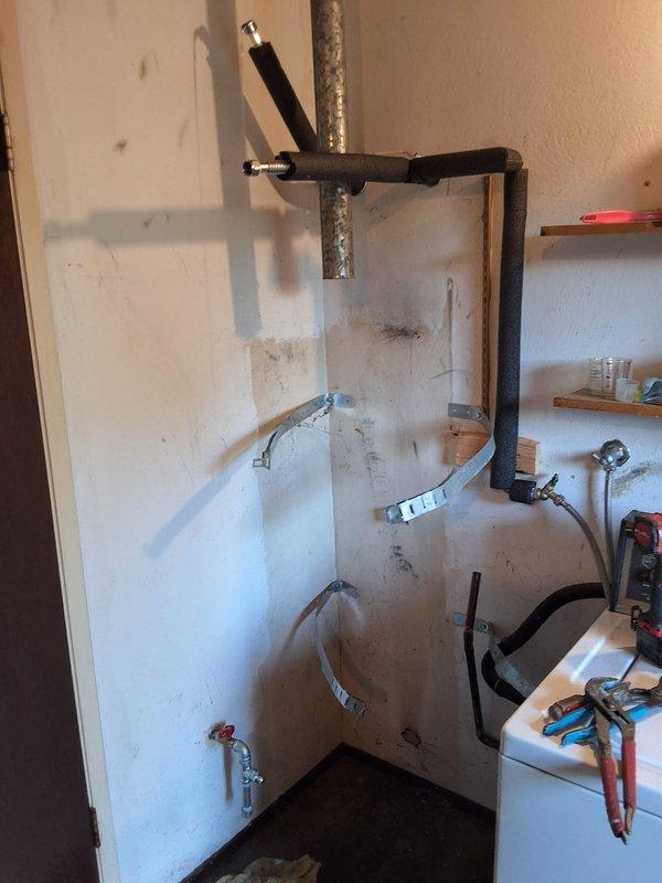 Removed the existing 20-year-old 40-gallon gas water heater, which had a failed burner assembly, and installed a new 40-gallon atmospheric-vent gas water heater (model GN40T1-3-6) with a 12-year warranty. The new unit was set on a drain pan and connected to the gas supply with a shutoff valve, water supply lines, and the existing galvanized vent, with an expansion tank in place on the supply side. Leak-checked all gas and water connections, verified proper ignition, burner operation, and venting, and cleaned the work area.
