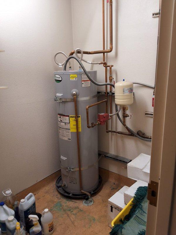 Evaluated a reported no-hot-water condition on a 2016 A.O. Smith 100-gallon commercial water heater serving an office building kitchen and four restrooms. Inspected the tank, discharge piping, expansion tank, recirculation pump, and electrical disconnect, documented the installation with photos, and provided a free estimate for replacement, including permitting requirements.