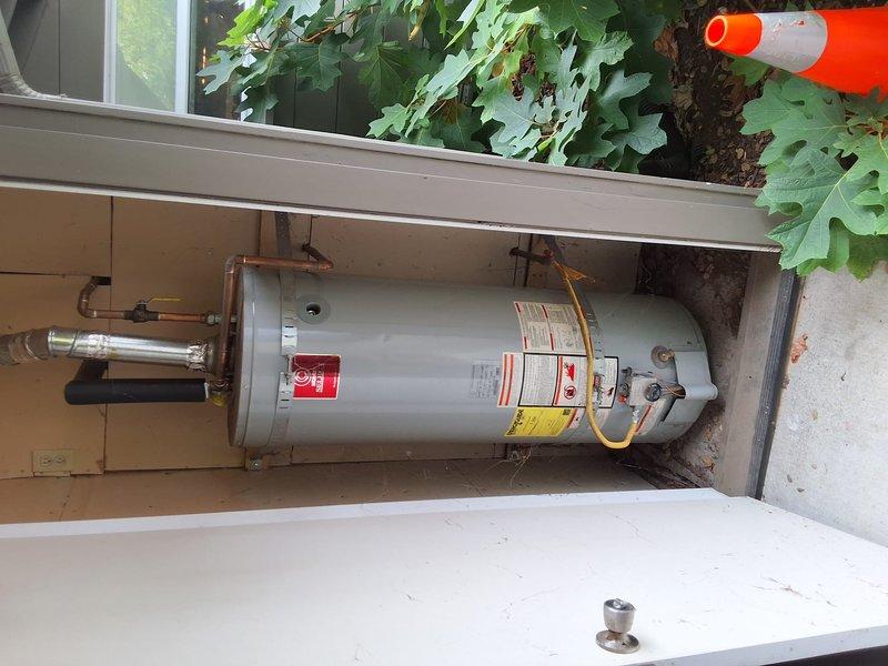 Performed an on-site inspection and estimate for replacement of an aging 40–50 gallon gas water heater installed in an exterior utility closet. Documented the existing unit's condition, including the gas control valve, flexible gas line, copper supply piping with shutoff valve, galvanized vent connection, and insulated piping, with no obvious signs of rust, frost, or leaks. Reviewed replacement options and permit requirements with the customer and provided a ballpark scope for like-for-like replacement, with final unit model selection to be confirmed.