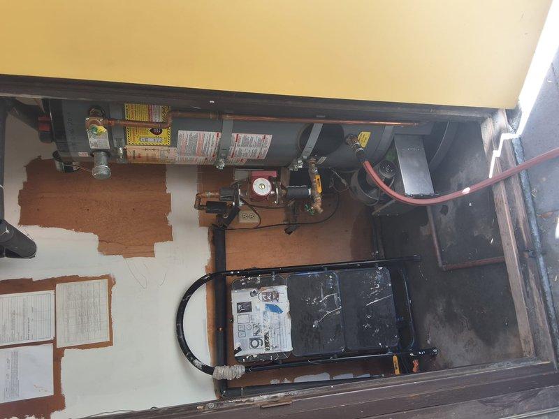 Inspected a 12-year-old commercial 80-gallon gas water heater (GNU76-200) reporting a bottom leak, confirming tank-shell failure and moisture staining on the floor beneath the unit in a confined mechanical closet with recirculation pump and copper supply piping. Estimate prepared for replacement of the failed unit with a new commercial 80-gallon water heater (UCG80H125 platform), pending determination of the number of units served, final model selection, and permitting requirements; payment options were not reviewed at this time.