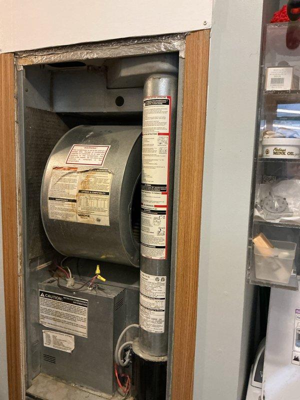 Conducted comprehensive assessment of 30-year-old propane furnace in manufactured home. Inspected internal components including motor, wiring, and ventilation system. Documented existing HVAC configuration and electrical capacity to evaluate feasibility of replacing with cold-climate ducted heat pump system versus new furnace installation, including potential rebate eligibility.