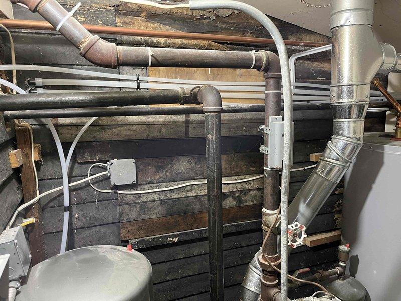 Successfully installed a Sterling water softener system in the client's utility area. The installation was completed as quoted, requiring access to both the basement mechanical room and crawl space to connect the unit to the existing plumbing system with copper piping.
