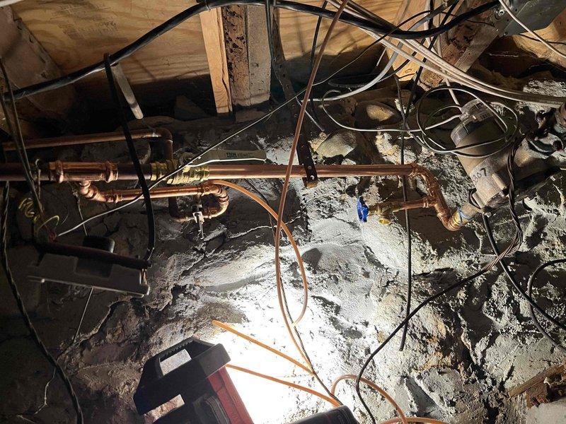 Successfully installed a Sterling water softener system in the client's utility area. The installation was completed as quoted, requiring access to both the basement mechanical room and crawl space to connect the unit to the existing plumbing system with copper piping.